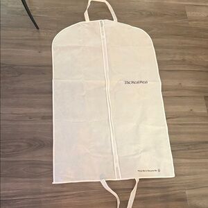 The RealReal hanging zip garment bag - white